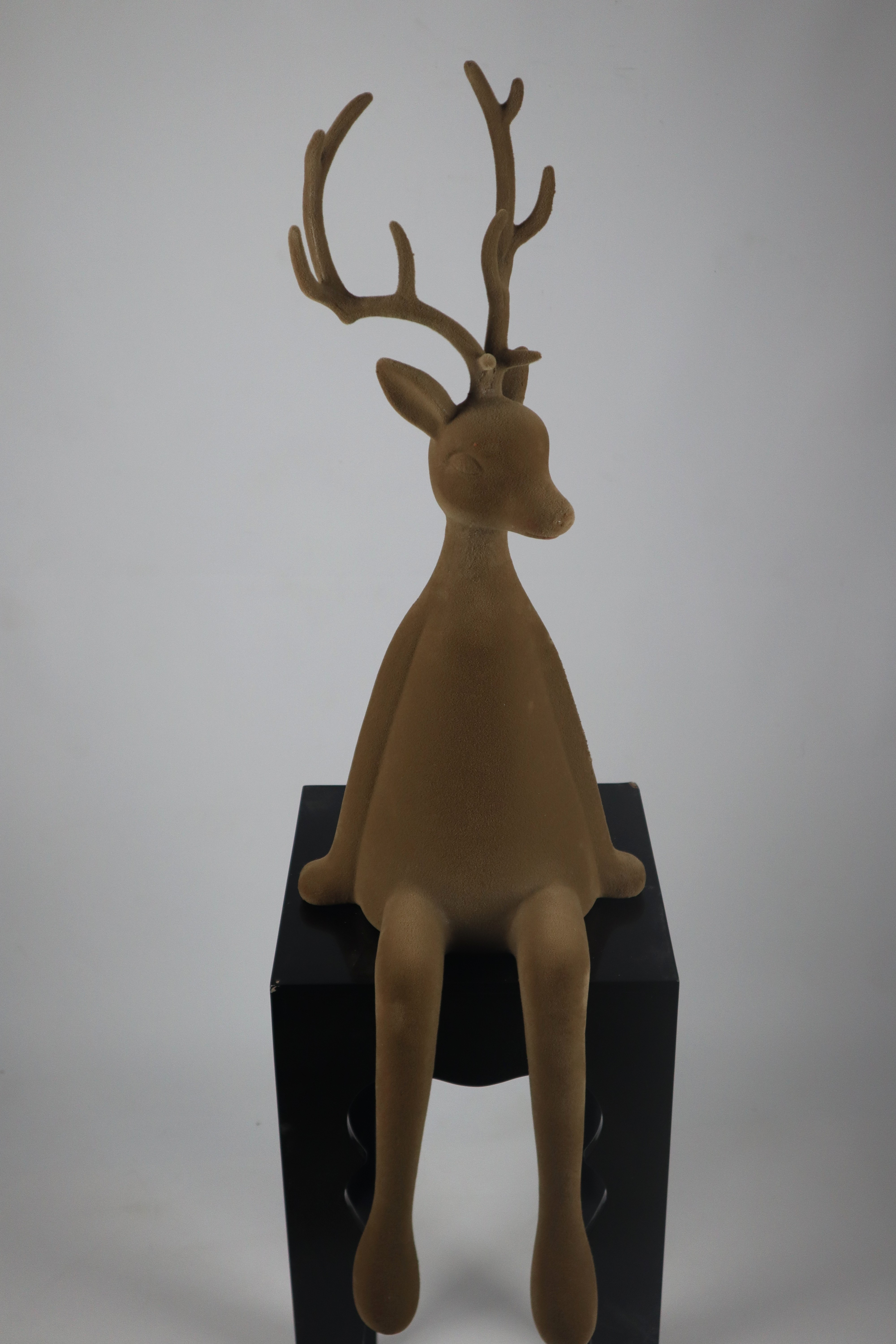 Rentier sitzend braun - Flock Kunstst. 93cm